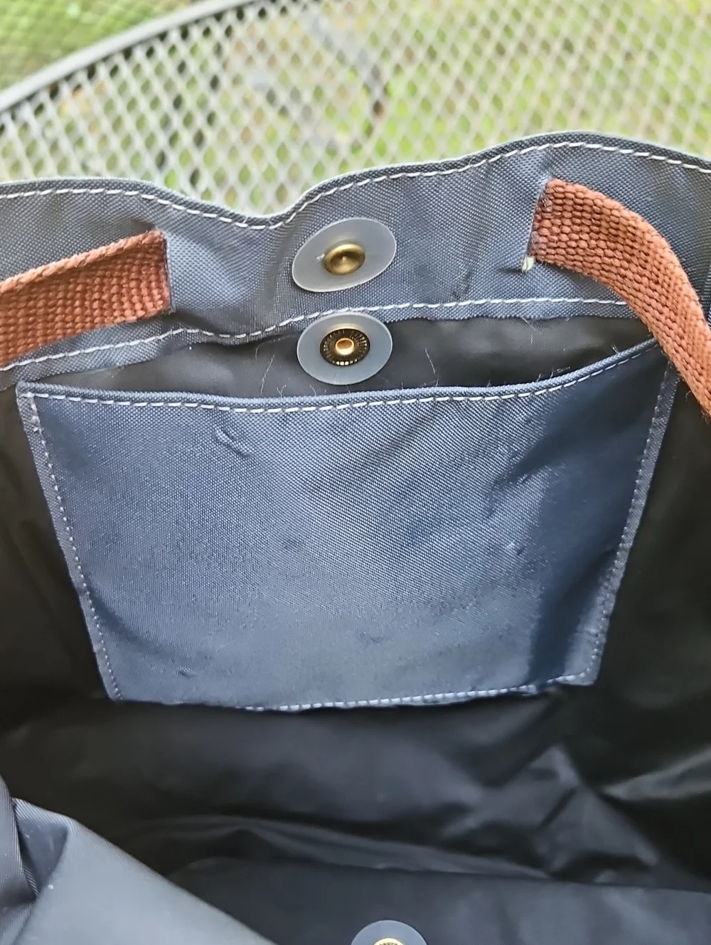 Longchamp navy nylon backpack with brown leather flap